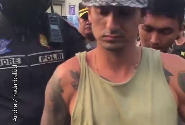 An Australian staying in Bali, Philip James Nelson (pictured) was halted by Bali police while driving a scooter without a helmet
