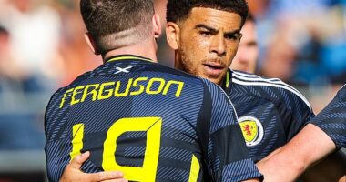 Che Adams is congratulated by Lewis Ferguson after scoring first goal of his hat-trick