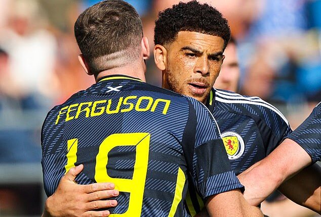 Che Adams is congratulated by Lewis Ferguson after scoring first goal of his hat-trick