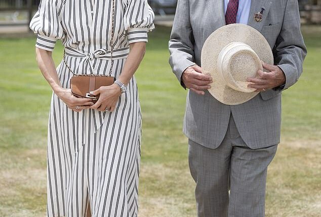 Wearing a fashionable navy striped summer dress, belted at the waist, Zara Phillips, 44, looked elegant as she prepared to present the Royal Windsor Cup on Sunday