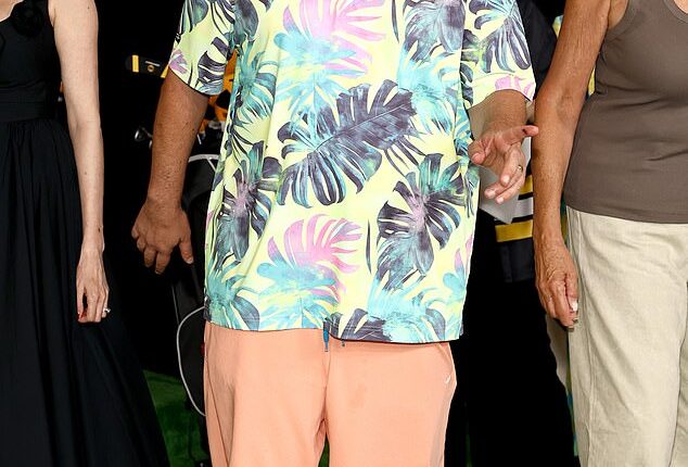 Adam Sandler, 58, donned a comfortable summer ensemble as he walked the red carpet in New York City for the premiere of his new Netflix film, Happy Gilmore 2