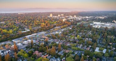 In the heart of wealthy California, a city has been ranked the fourth most ‘impossibly unaffordable’ place on Earth - surpassed only by three major global metros (pictured: aerial of Silicon Valley)