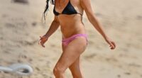 Andrea Corr turned heads in a mismatched bikini as she enjoyed a relaxing beach stroll in Barbados on Thursday