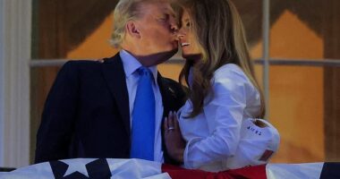 President Donald Trump (left) and first lady Melania Trump (right) smooched on the Truman Balcony ahead of the Washington, D.C. fireworks display marking the Fourth of July Friday