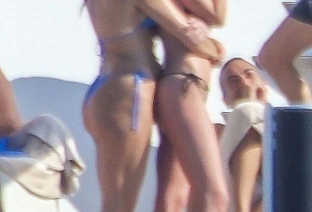 Bikini-clad Dakota Johnson, 35, and BFF Kate Hudson, 46, cuddled up for a friendly embrace as they joined other stars such as Tom Brady on a luxurious yacht in Ibiza