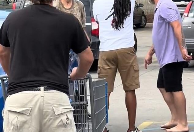 The suspect, a 42-year-old man, is seen being confronted by ordinary shoppers after he rampaged through the Walmart in Michigan