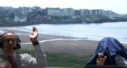 Kevin Kisner and Dan Hicks took shelter as a bat invaded the NBC studio at The Open