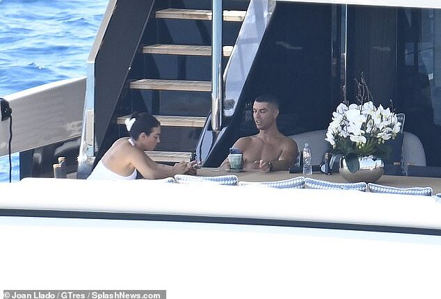 Cristiano Ronaldo holidays on a yacht in Mallorca with partner Georgina Rodriguez amid questions over why he didn't attend team-mate Diogo Jota's funeral for 'personal reasons'