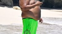 DJ Khaled came close to showing off more of his figure than he intended to when he was seen enjoying a beach day in Barbados