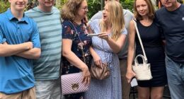 A woman whose mom was fiercely slammed over her 'rude' reaction to her pregnancy reveal has explained what really happened