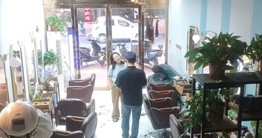 A Chinese woman went to her local salon to get a haircut, but asked to borrow some money from the owner when she realised she'd left her purse at home (Pictured: CCTV of the incident)