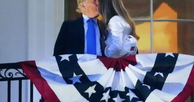 President Donald Trump and first lady Melania Trump were caught kissing from the Truman Balcony on Friday ahead of Washington, D.C.'s grand Fourth of July fireworks display. The first couple kissed and hugged as supporters down below 'awww'-ed the scene.
