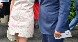 Michael McIntyre cosied up to leggy wife Kitty as they attended day eight of Wimbledon at The All England Lawn Tennis Club on Monday