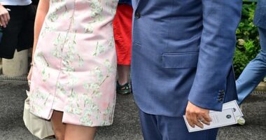 Michael McIntyre cosied up to leggy wife Kitty as they attended day eight of Wimbledon at The All England Lawn Tennis Club on Monday