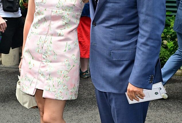 Michael McIntyre cosied up to leggy wife Kitty as they attended day eight of Wimbledon at The All England Lawn Tennis Club on Monday