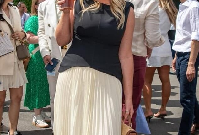 Emily Atack jokes she was 'fully clothed' as she attended Wimbledon - after THAT naked tennis scene in racy series Rivals