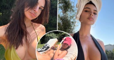 Emily Ratajkowski sunbathes in nothing but a baseball cap