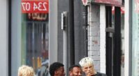 Alejandro Garnacho (right) posed for selfies with fans after getting a haircut on Monday