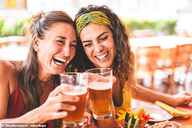 While many Brit are reaching for fans, ice lollies and cold showers, Dr Stuart Galloway, of the University of Stirling, revealed that indulging in a post-work pint could actually be helpful (stock image)