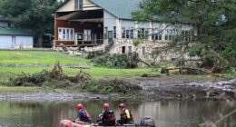 A search and rescue team looks for people along the Guadalupe River near a damaged building at Camp Mystic in Hunt, Texas, on July 7, 2025
