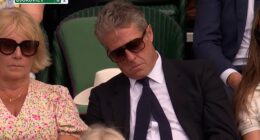 The excitement of the Wimbledon quarter-finals was too much for Hugh Grant , as he appeared to fall asleep while on camera in the Royal Box