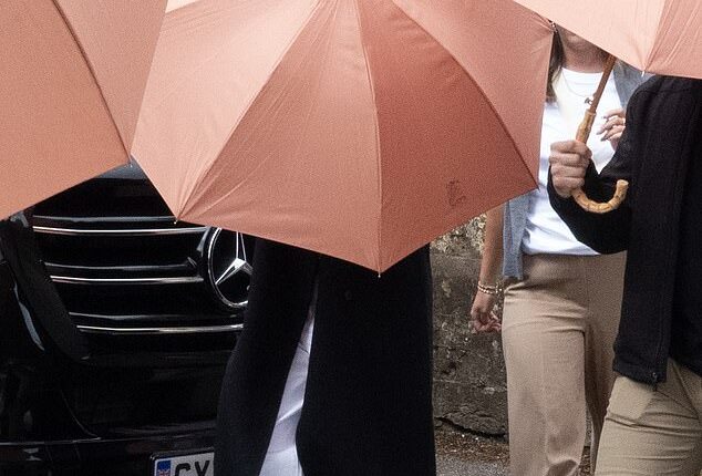 Apple heiress Eve Jobs has gone through some of the final preparations for her society wedding of the year, carrying out a complete church ceremony rehearsal of her marriage to Team GB showjumper Harry Charles on Thursday morning. Pictured, Eve is believed to be the chic bride standing behind the umbrella
