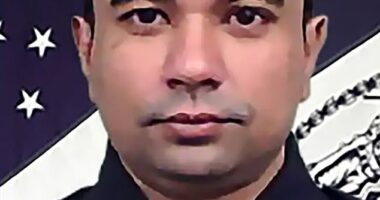 Officer Didarul Islam (pictured), 36, was shot in the back and killed by a gunman seen carrying an M4 assault rifle near a midtown Manhattan office building that houses Blackstone asset management and the NFL on Monday