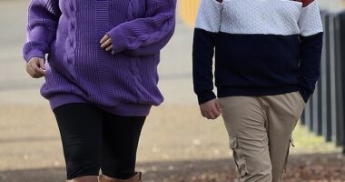 Home and Away star Christie Hayes shows off her baby bump during a stroll with her son in Tasmania