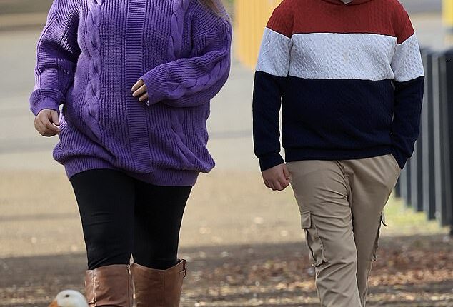 Home and Away star Christie Hayes shows off her baby bump during a stroll with her son in Tasmania