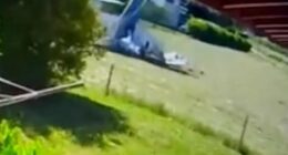 This is the horrifying moment a tourist plane nose dives and crashes yards from houses in the French Alpes - killing three