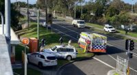 Police are pictured outside Waratah train station in Mayfield on Tuesday morning