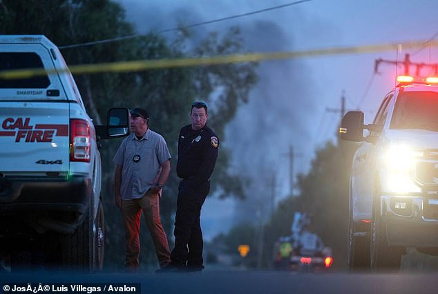 Authorities confirmed the discovery of human remains at the site of a devastating fireworks explosion in California that rocked the small farming community of Esparto on Tuesday. Pictured: Emergency crews gather in Esparto, near the location of a fireworks explosion