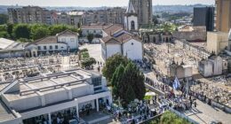 An aerial view shows the line of mourners snaking from the chapel to the church (top, middle of shot) where Jota's funeral will be held tomorrow