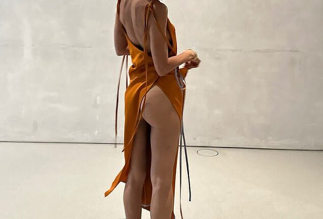 Iris Law flashed her bottom and went braless as she shared a cheeky insight into her summer on Instagram on Monday