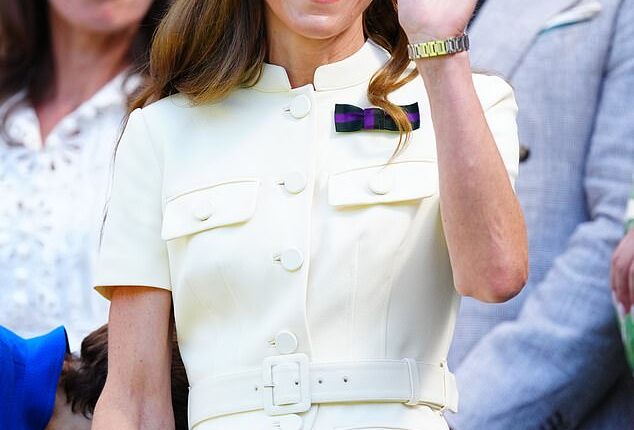 The Princess of Wales waves to the crowd as she was greeted by a huge standing ovation