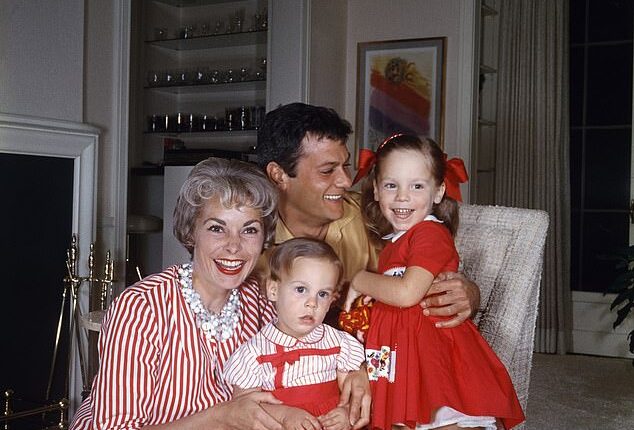 Jamie Lee Curtis (R, pictured in 1958) calls herself the 'OG nepo baby' having had a leg up in showbusiness thanks to her famous parents Janet Leigh and Tony Curtis