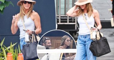 Jennifer Aniston all smiles after Mallorca vacation with Jim Curtis