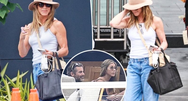 Jennifer Aniston all smiles after Mallorca vacation with Jim Curtis