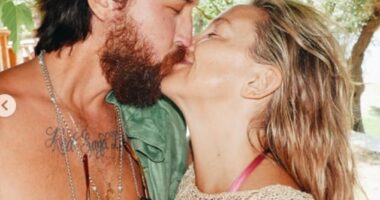 Kate Hudson packed on the PDA with her fiancé Danny Fujikawa as she slipped into a pink bikini in snaps from her Greek family holiday on Instagram on Thursday