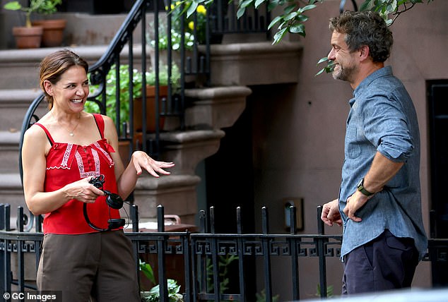 Katie Holmes couldn't contain her happiness as she and ex-boyfriend Joshua Jackson continued to film their upcoming trilogy Happy Hours