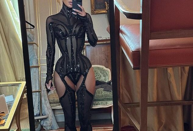 Kim Kardashian put on a very daring display in a dramatic, see-through corset look in her latest thirst trap