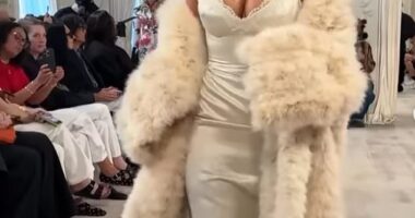 Kim Kardashian is being roundly trolled for her awkward runway walk, with fans sniggering that she looked 'drunk' or 'like a tired toddler'