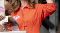 Lady Victoria Starmer embraced the warm weather in a bright orange sundress as she arrived at Ascot Racecourse today - without the prime minister