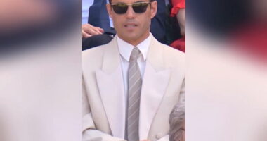 Leonardo DiCaprio laughs with Wimbledon spectators in Royal Box