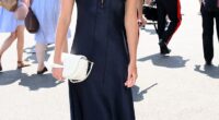 Lila Moss cut a sophisticated figure in a navy dress as she arrived at the All England Lawn Tennis and Croquet Club on Sunday for day 14 of Wimbledon