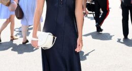 Lila Moss cut a sophisticated figure in a navy dress as she arrived at the All England Lawn Tennis and Croquet Club on Sunday for day 14 of Wimbledon
