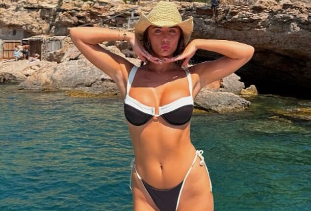 Millie Court showed off her amazing figure in a skimpy black and white bikini as she enjoyed a sun-soaked holiday in Ibiza on Sunday