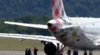 Footage from the runway appears to show people surrounding the aircraft around the time of the accident