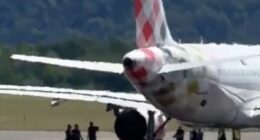 Footage from the runway appears to show people surrounding the aircraft around the time of the accident
