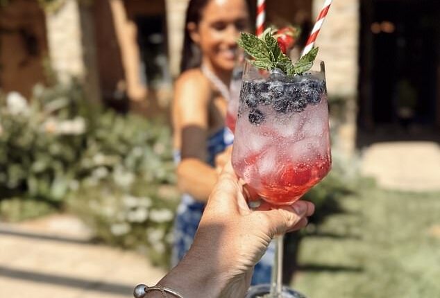 Meghan Markle has shared the recipe for a very patriotic Fourth of July cocktail - as she celebrated the US holiday in a chic blue and white two-piece